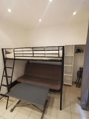 a bunk bed in a room next to a wall at Studio Cannes centre in Cannes