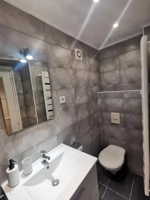 a bathroom with a white sink and a toilet at Studio Cannes centre in Cannes