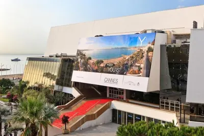 a large building with a large billboard on it at Studio Cannes centre in Cannes
