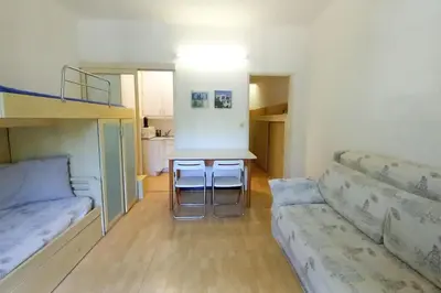 a room with a bed and a table and a couch at Rocamare in Cannes