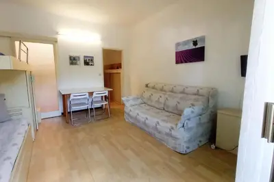 a living room with a couch and a table at Rocamare in Cannes
