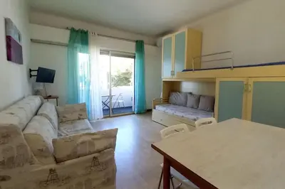 a living room with a couch and a table at Rocamare in Cannes