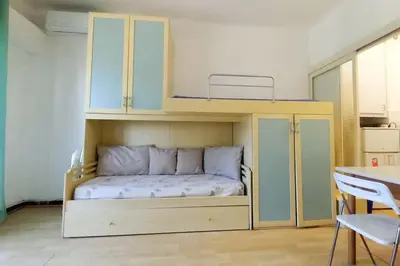 a bedroom with a bunk bed in a room at Rocamare in Cannes