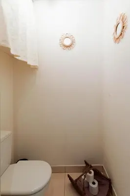 a bathroom with a toilet and two rolls of toilet paper at Cristal Croisette YourHostHelper in Cannes