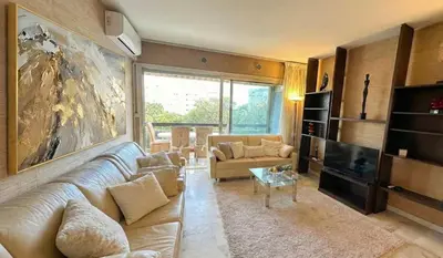 a bedroom with a large bed and a large window at B038 Spacieux Appartement proche Croisette parking in Cannes