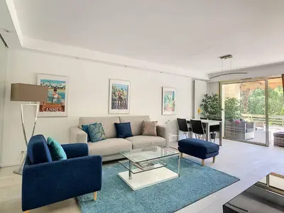 a living room with a couch and a table at Appartement 2 Pièces,Cannes, Résidence Le Merival in Cannes