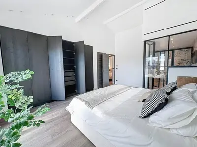 a bedroom with a large bed and a large window at 79m2 Penthouse, Palais et plages à 400m rooftop in Cannes