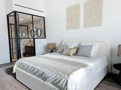a white bedroom with a large white bed and mirrors at 79m2 Penthouse, Palais et plages à 400m rooftop in Cannes