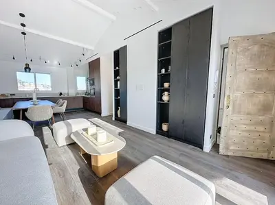 a living room with a couch and a table at 79m2 Penthouse, Palais et plages à 400m rooftop in Cannes