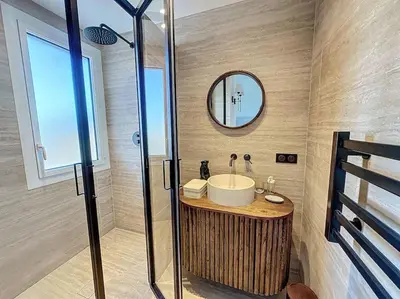 a bathroom with a sink and a mirror at 79m2 Penthouse, Palais et plages à 400m rooftop in Cannes