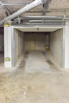 an empty room in a building with a concrete floor at Modern apartment with swimming pool in Cannes