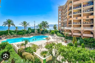 an apartment with a swimming pool and a resort at Cannes appartement vue mer , piscine in Cannes