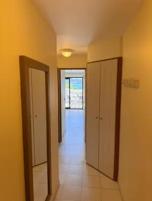 a hallway with two doors and a tile floor at Cannes appartement vue mer , piscine in Cannes