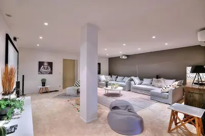 a living room with a couch and a table at Villa CANNES in Cannes