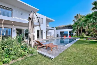 a villa with a swimming pool and a house at Villa CANNES in Cannes