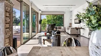 a living room with a couch and a table at Villa CANNES in Cannes