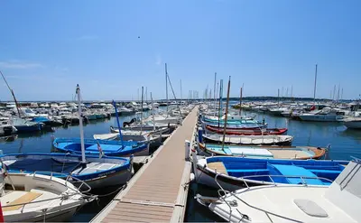 a bunch of boats docked in a harbor at Appartement neuf Pointe Croisette, 50 m de la mer in Cannes