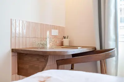 a desk in a room with a bed at Le Bonheur - 5mins Palais des Festivals in Cannes