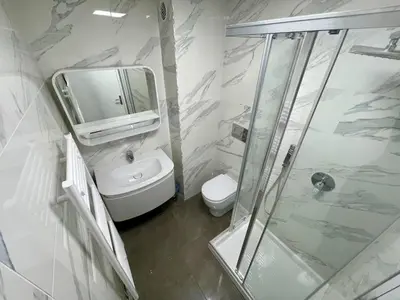 a bathroom with a toilet and a sink and a mirror at Isola Bella by Connexion in Cannes