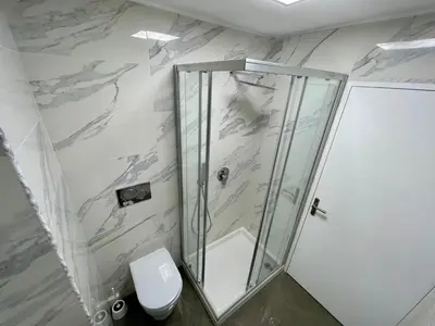 a bathroom with a shower and a toilet at Isola Bella by Connexion in Cannes