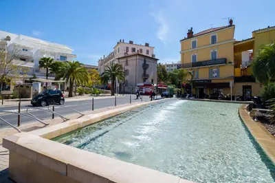 a fountain in the middle of a city street at Isola Bella by Connexion in Cannes