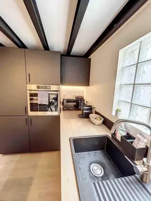 a kitchen with a sink and a stove at BRP Cannes Center,Two-Bed Deluxe Apart with Spa bath in Cannes