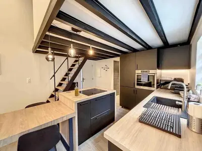 a kitchen with a sink and a staircase in it at BRP Cannes Center,Two-Bed Deluxe Apart with Spa bath in Cannes