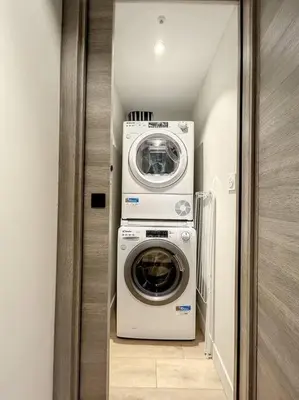 a washer and dryer in a small room at BRP Cannes Center, Top floor Luxurious Apartment II, 4 bedrooms+3 bathrooms in Cannes