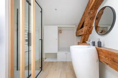 a bathroom with a white tub and a mirror at BRP Cannes Center, Top floor Luxurious Apartment II, 4 bedrooms+3 bathrooms in Cannes