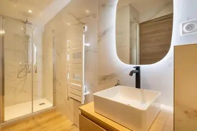 a white bathroom with a sink and a shower at BRP Cannes Center,Top floor Luxurious house,8 bed in Cannes