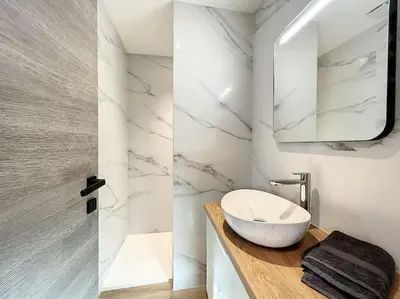 a white bathroom with a sink and a mirror at BRP Cannes Center,Top floor Luxurious house,8 bed in Cannes