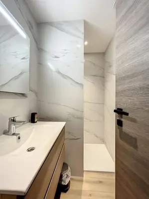 a bathroom with a sink and a mirror and a shower at BRP Cannes Center,Top floor Luxurious house,8 bed in Cannes