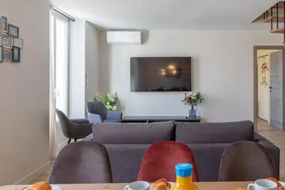 a living room with a couch and chairs at BRP Cannes Center,Top floor Luxurious house,8 bed in Cannes