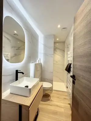 a white bathroom with a sink and a toilet at BRP Cannes Center,Top floor Luxurious house,8 bed in Cannes