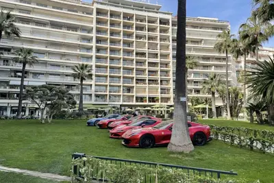 a row of cars parked in front of a large building at Luxury Romantic Cannes 45 Croisette Two Bedrooms in Cannes