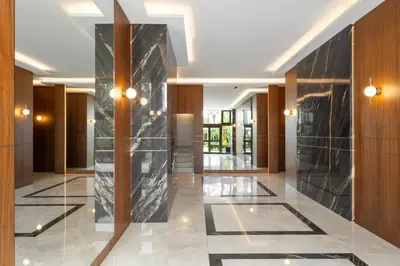 a lobby with a black marble wall and lights at Luxury Romantic Cannes 45 Croisette Two Bedrooms in Cannes