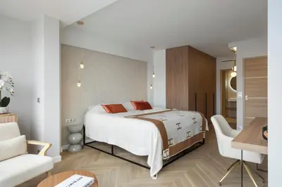 a bedroom with a bed and a living room at Luxury Romantic Cannes 45 Croisette Two Bedrooms in Cannes