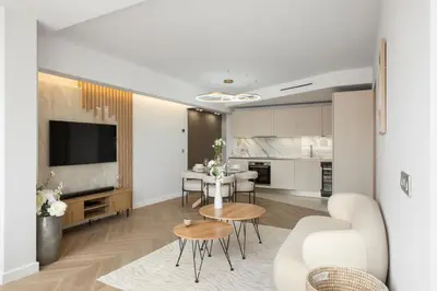 a living room with a table and a kitchen at Luxury Romantic Cannes 45 Croisette Two Bedrooms in Cannes
