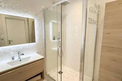 a bathroom with a glass shower and a sink at REF 1337 - Cannes Croisette - Sea view apartment for rent in Cannes