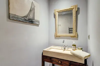 a bathroom with a sink and a mirror at Charming studio In the heart of Cannes in Cannes