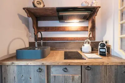 a kitchen counter with a sink and a stove at Charming studio In the heart of Cannes in Cannes