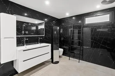 a black bathroom with a sink and a shower at Havre de Paix avec Villa Prestige Cannes Luxe, Piscine Chauffée, Alarme, Caméras Parking privée in Le Cannet