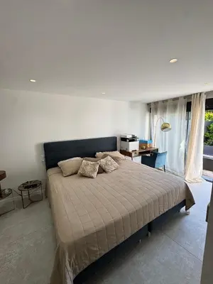 a bedroom with a bed and a desk and window at Havre de Paix avec Villa Prestige Cannes Luxe, Piscine Chauffée, Alarme, Caméras Parking privée in Le Cannet
