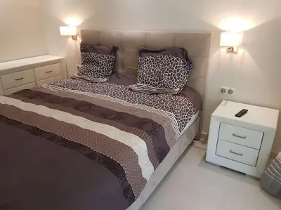 a bedroom with a bed with pillows on it at Cannes appartement 3 chambres - 8D in Cannes