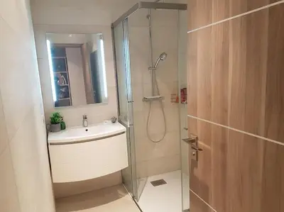 a bathroom with a shower and a sink at Cannes appartement 3 chambres - 8D in Cannes
