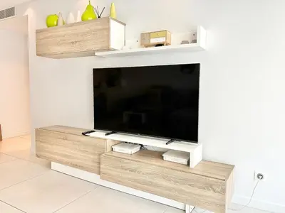 a living room with a flat screen tv on a wall at Cannes appartement 3 chambres - 8D in Cannes