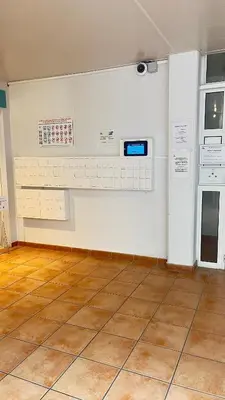 an empty room with a kitchen with a stove at CANNES Appartement - terrasse, jardin prive, parking, piscine, climatisation in Cannes