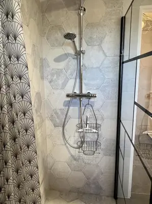 a bathroom with a shower with a towel rack at Maison de charme idéalement située in Cannes