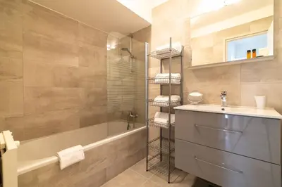 a bathroom with a sink and a tub and a shower at A083 - Modern & Bright apt - Cannes center in Cannes