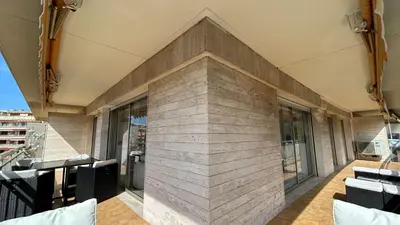 a brick wall on the side of a building at A083 - Modern & Bright apt - Cannes center in Cannes